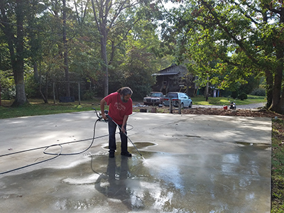 middle school staff member power washing